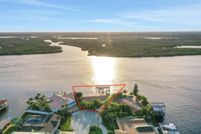 an aerial view of a ocean view and mountain view