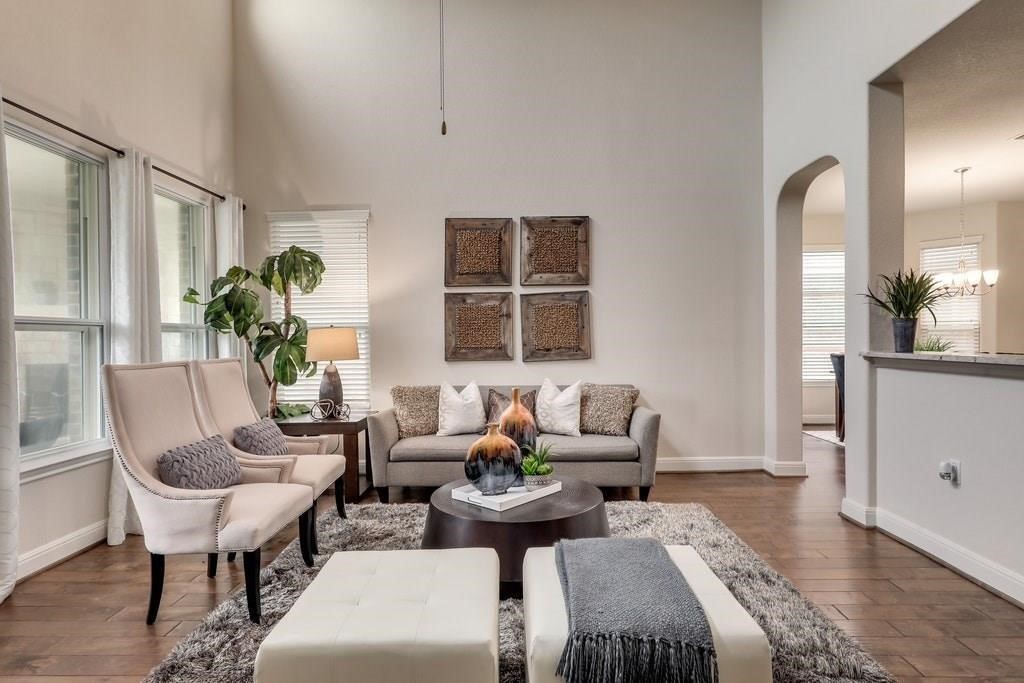 10825 Ballard Path Austin, TX 78717 - Photo 7 of 39 a living room with furniture potted plant a window and a mirror