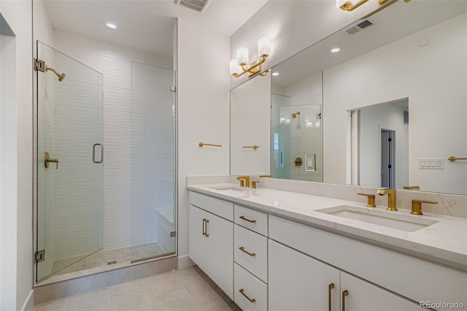 765 Superior Drive Superior, CO 80027 - Photo 19 of 32 a bathroom with a granite countertop sink mirror and double