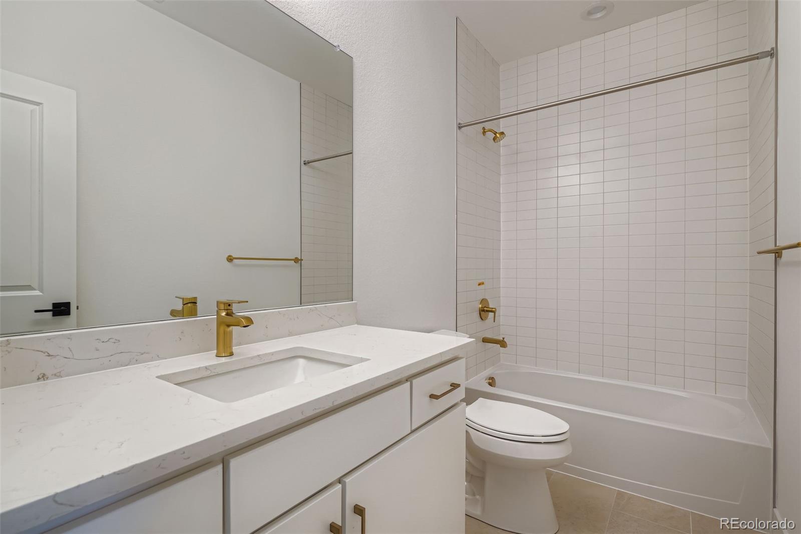 765 Superior Drive Superior, CO 80027 - Photo 21 of 32 a bathroom with a sink a toilet and shower