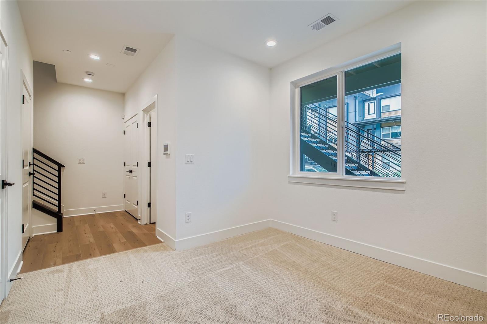 765 Superior Drive Superior, CO 80027 - Photo 24 of 32 wooden floor in an empty room with a window