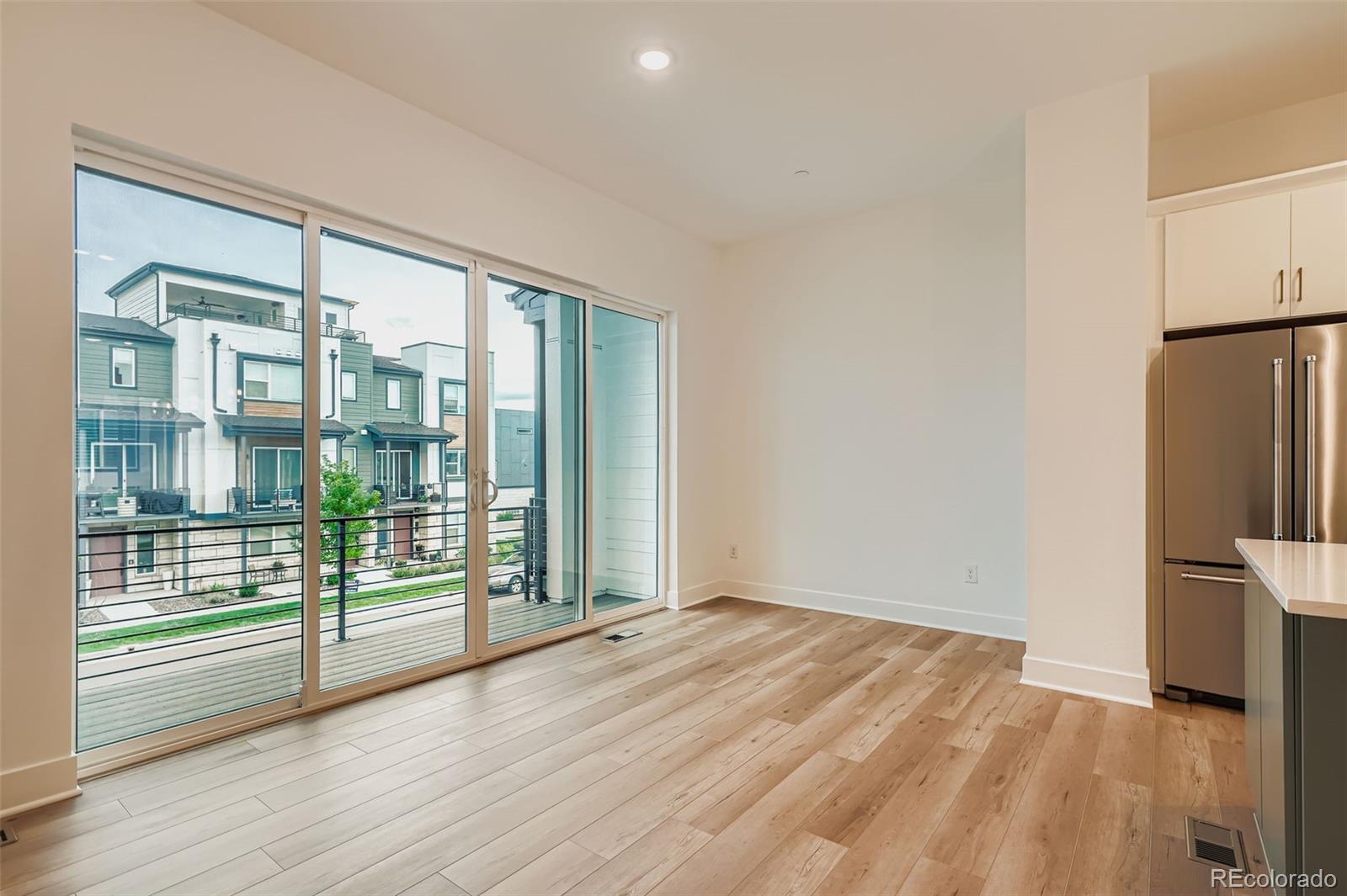 765 Superior Drive Superior, CO 80027 - Photo 7 of 32 a view of empty room with wooden floor and fan