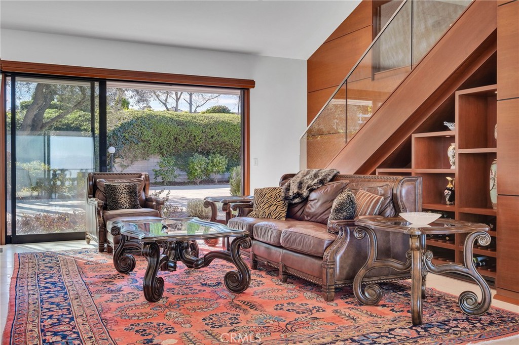 15 Caballeros Road Rolling Hills, CA 90274 - Photo 18 of 70 a living room with furniture and a large window