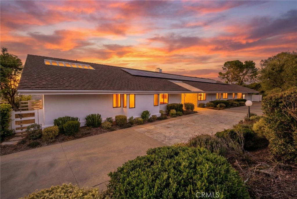 15 Caballeros Road Rolling Hills, CA 90274 - Photo 2 of 70 a front view of a house with a yard and garage