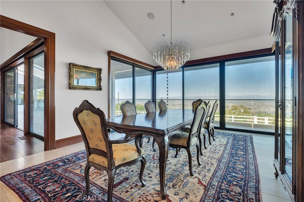 15 Caballeros Road Rolling Hills, CA 90274 - Photo 22 of 70 a view of a dining room with furniture window and wooden floor