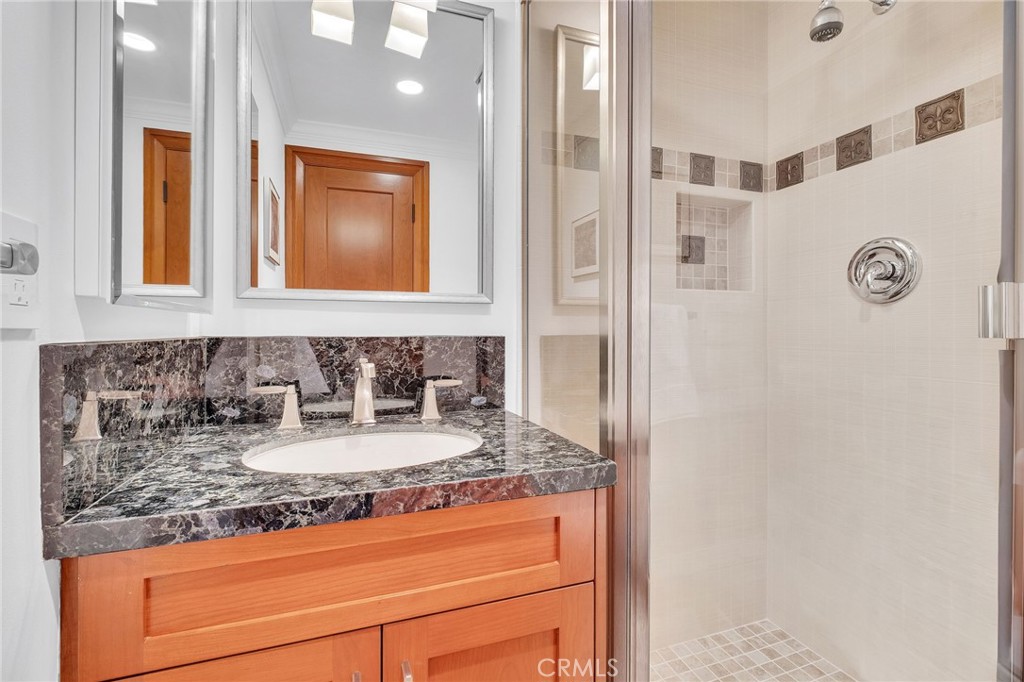 15 Caballeros Road Rolling Hills, CA 90274 - Photo 38 of 70 a bathroom with sink granite and mirror