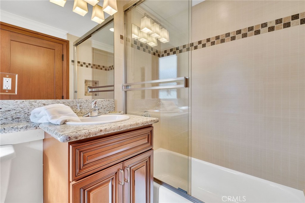 15 Caballeros Road Rolling Hills, CA 90274 - Photo 40 of 70 a bathroom with a granite countertop sink a mirror and shower