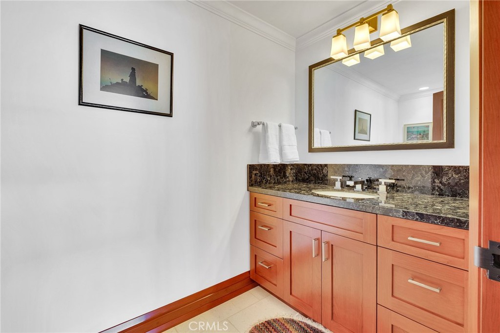 15 Caballeros Road Rolling Hills, CA 90274 - Photo 41 of 70 a bathroom with a sink and a mirror