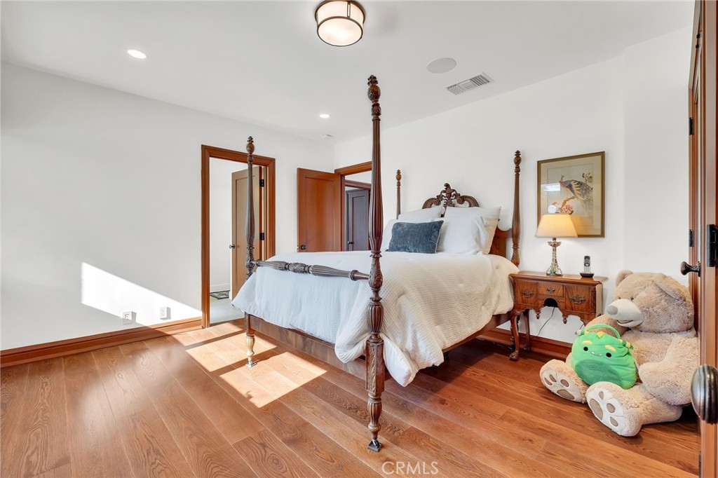 15 Caballeros Road Rolling Hills, CA 90274 - Photo 44 of 70 a bedroom with a bed and wooden floor
