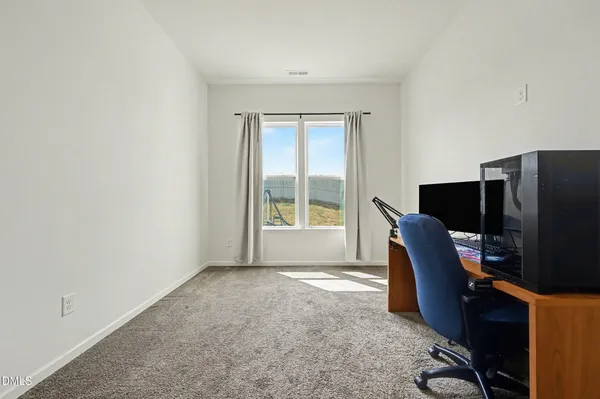a workspace with furniture and a window