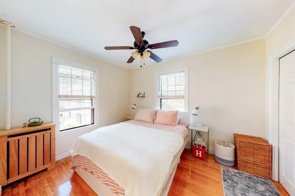 a bed room with a bed and a window