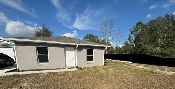 a front view of house with yard