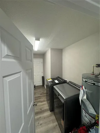 a view of hallway with wooden floor