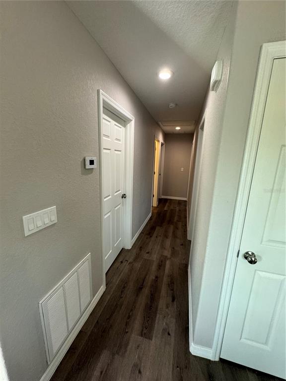 13183 Southwest 113th Place Dunnellon, FL 34432 - Photo 14 of 22 a view of hallway with wooden floor