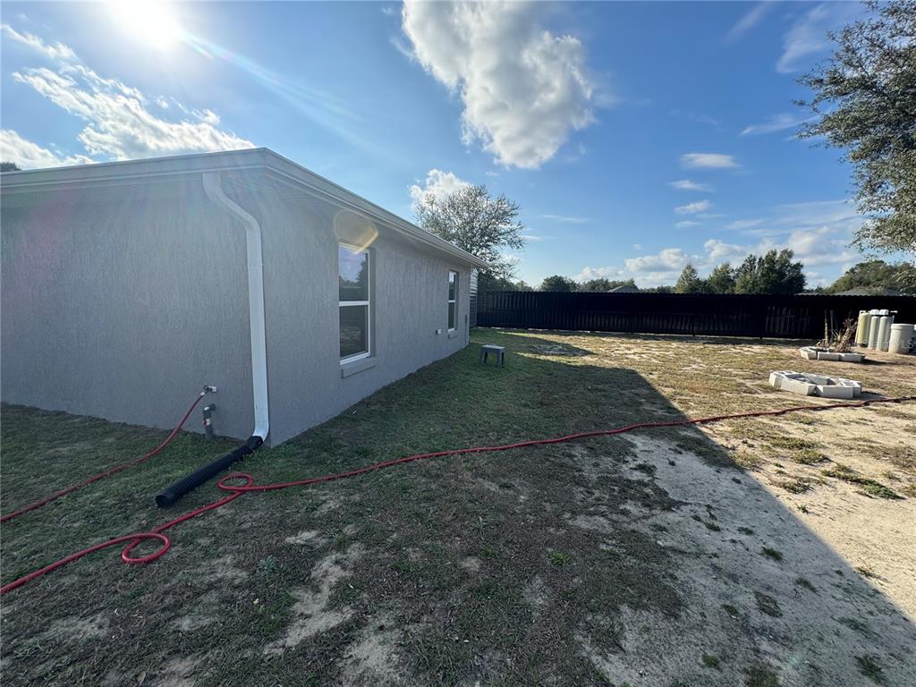 13183 Southwest 113th Place Dunnellon, FL 34432 - Photo 4 of 22 a view of a backyard of the house