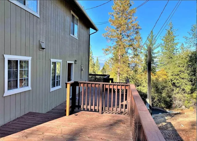 a view of balcony with furniture and wooden floor