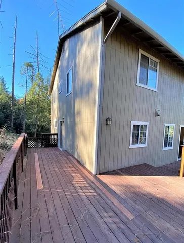 a view of backyard with small cabin
