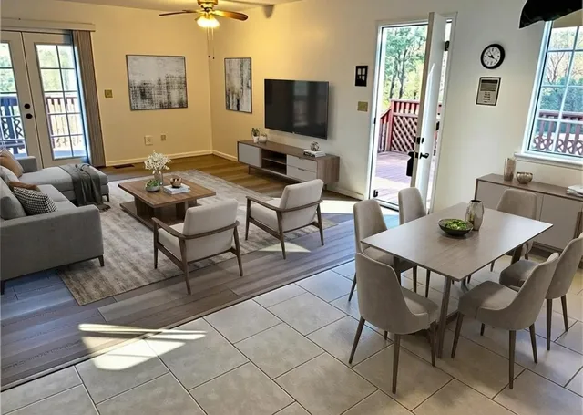 a living room with furniture and a flat screen tv