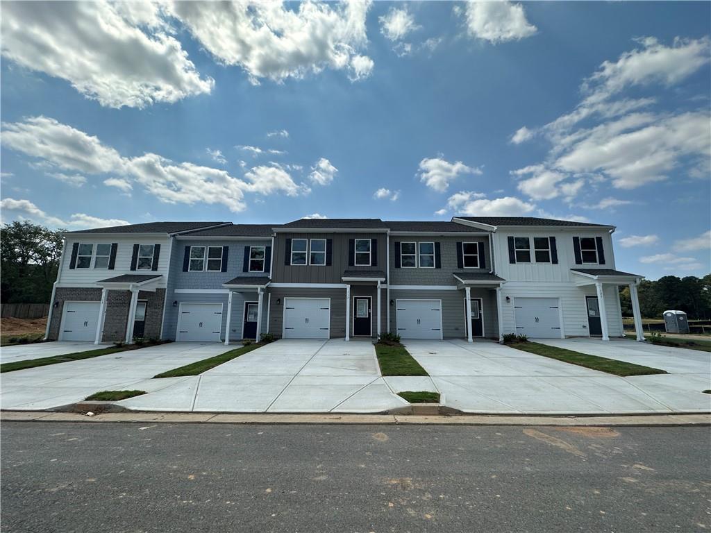 a view of a house with a patio yard and sitting area