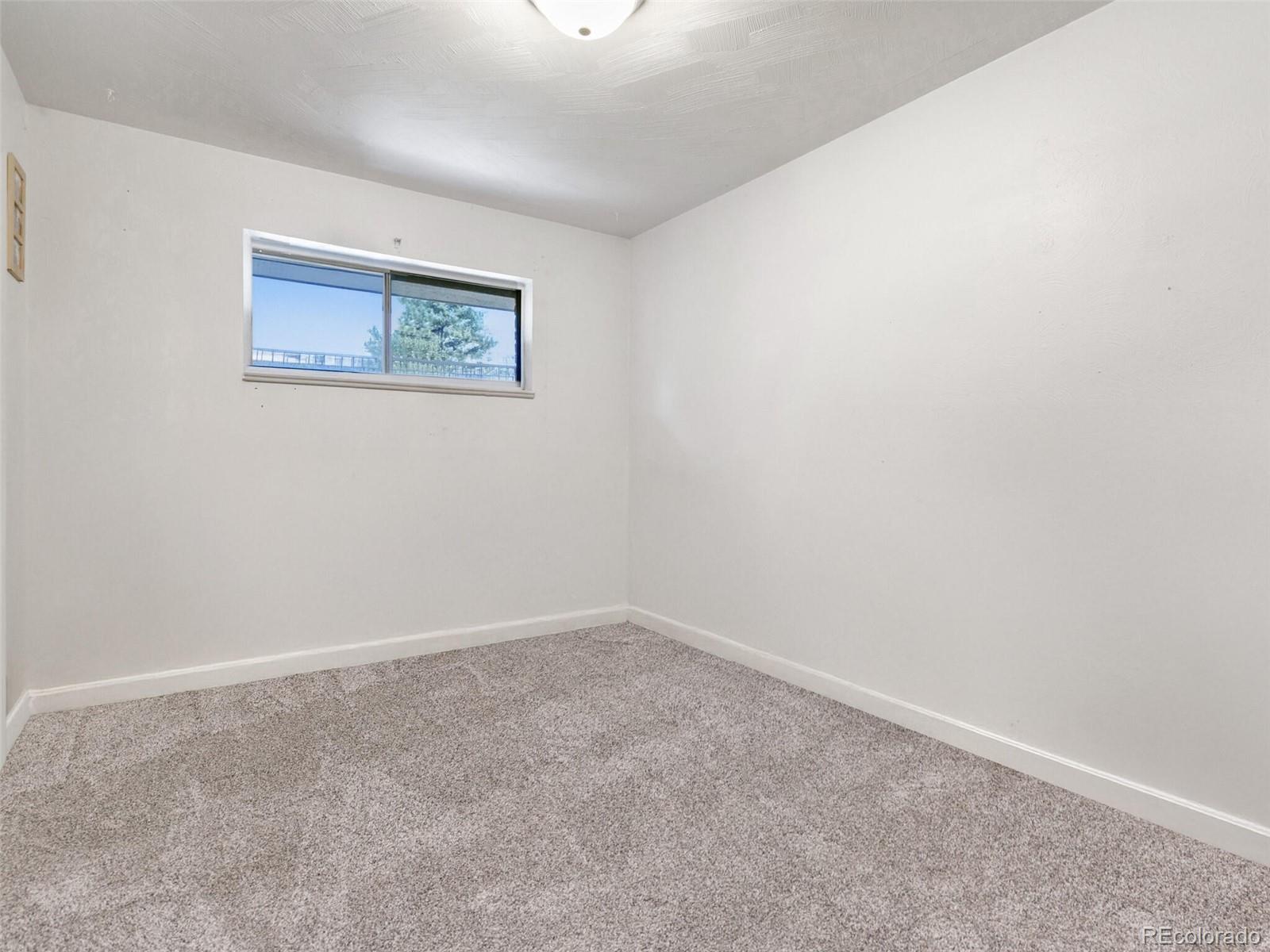 4615 Field Street Wheat Ridge, CO 80033 - Photo 16 of 39 an empty room with a window