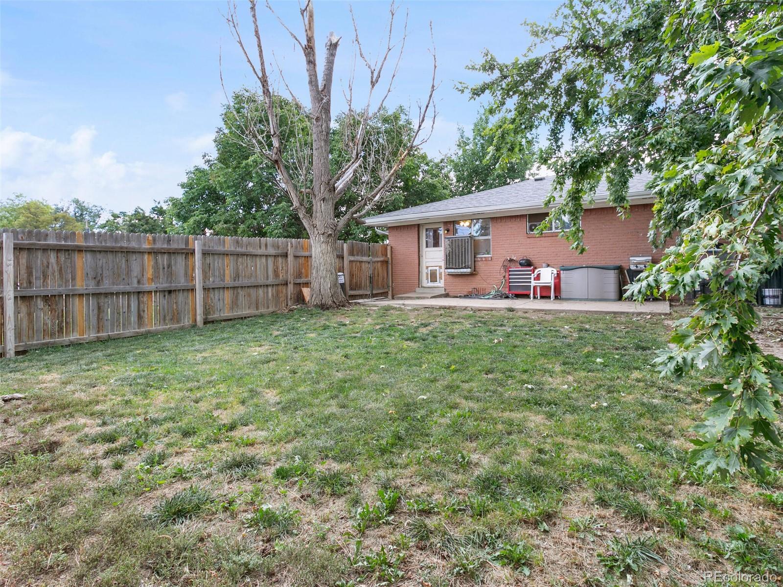 4615 Field Street Wheat Ridge, CO 80033 - Photo 18 of 39 a view of a house with a yard and sitting area