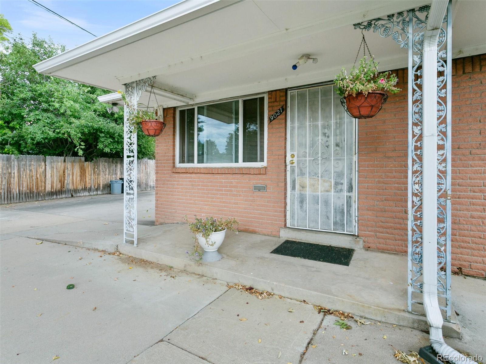 4615 Field Street Wheat Ridge, CO 80033 - Photo 19 of 39 a front view of a house with a porch