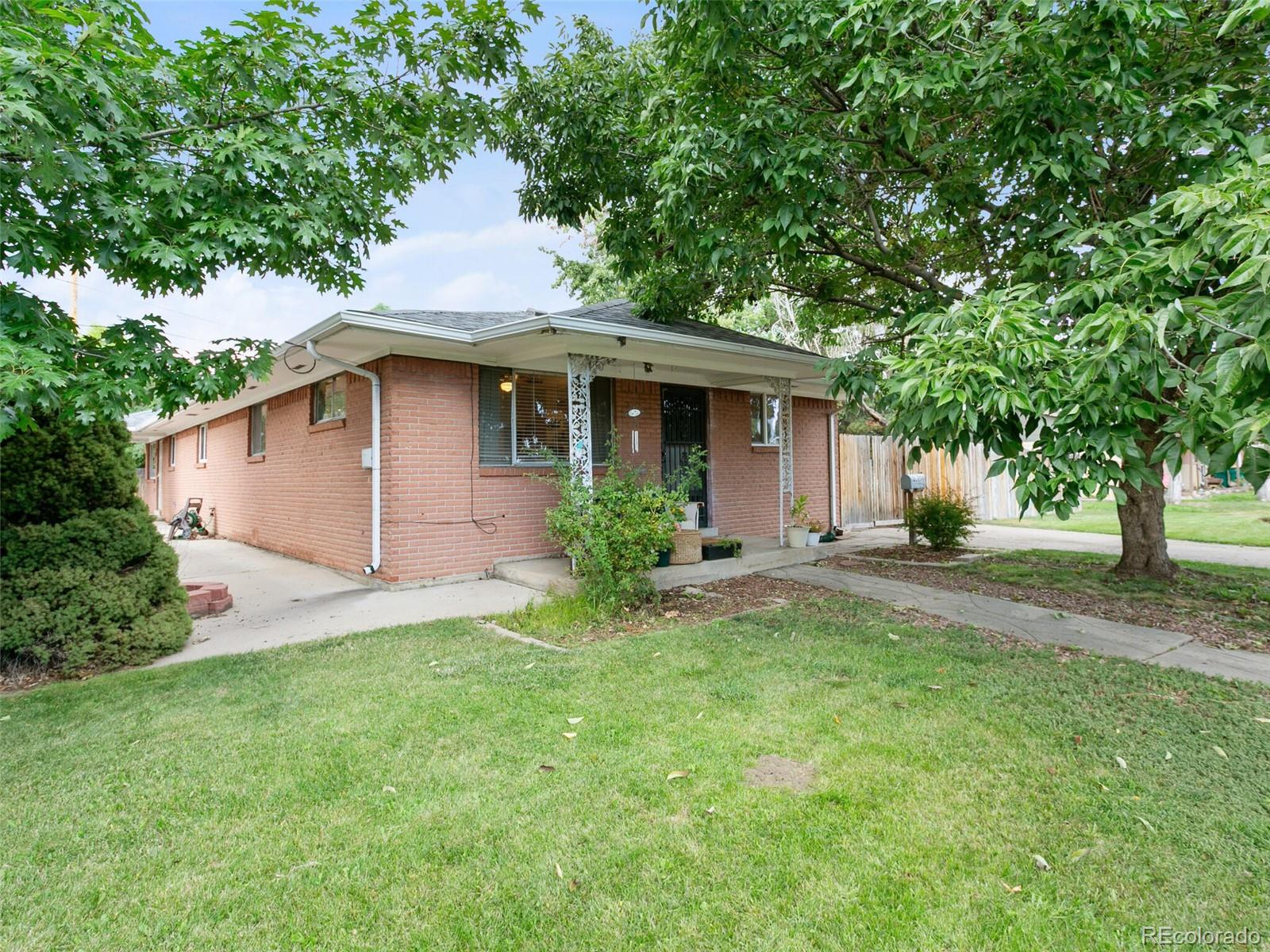 4615 Field Street Wheat Ridge, CO 80033 - Photo 2 of 39 a view of a house with a yard and tree s