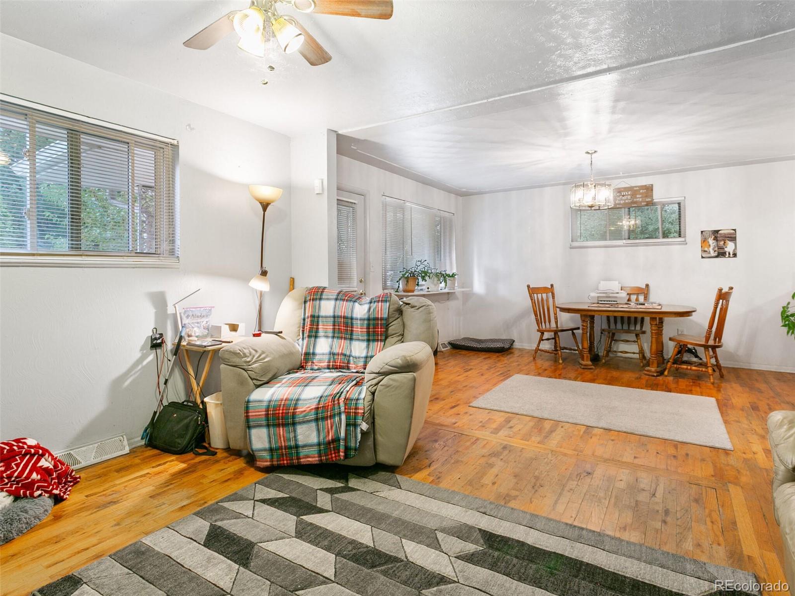 4615 Field Street Wheat Ridge, CO 80033 - Photo 29 of 39 a living room with furniture and a large window