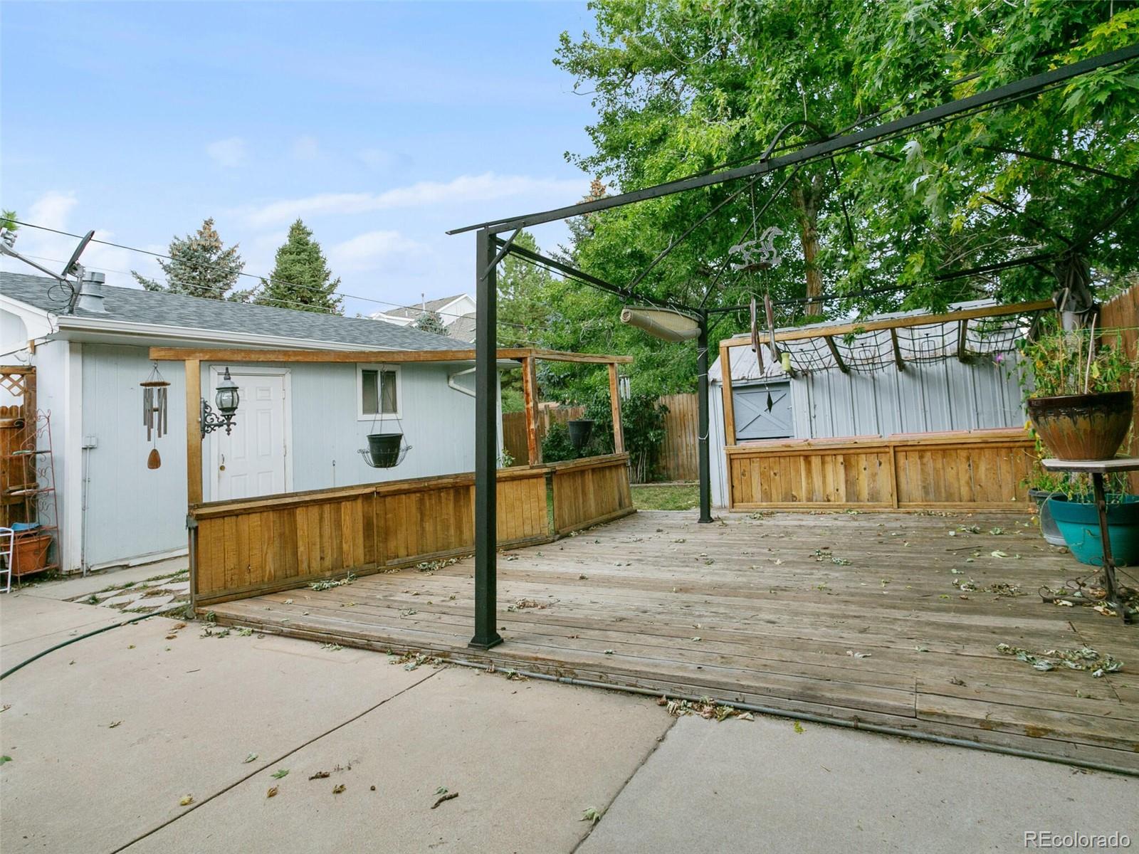 4615 Field Street Wheat Ridge, CO 80033 - Photo 36 of 39 a front view of a house with a yard and garage