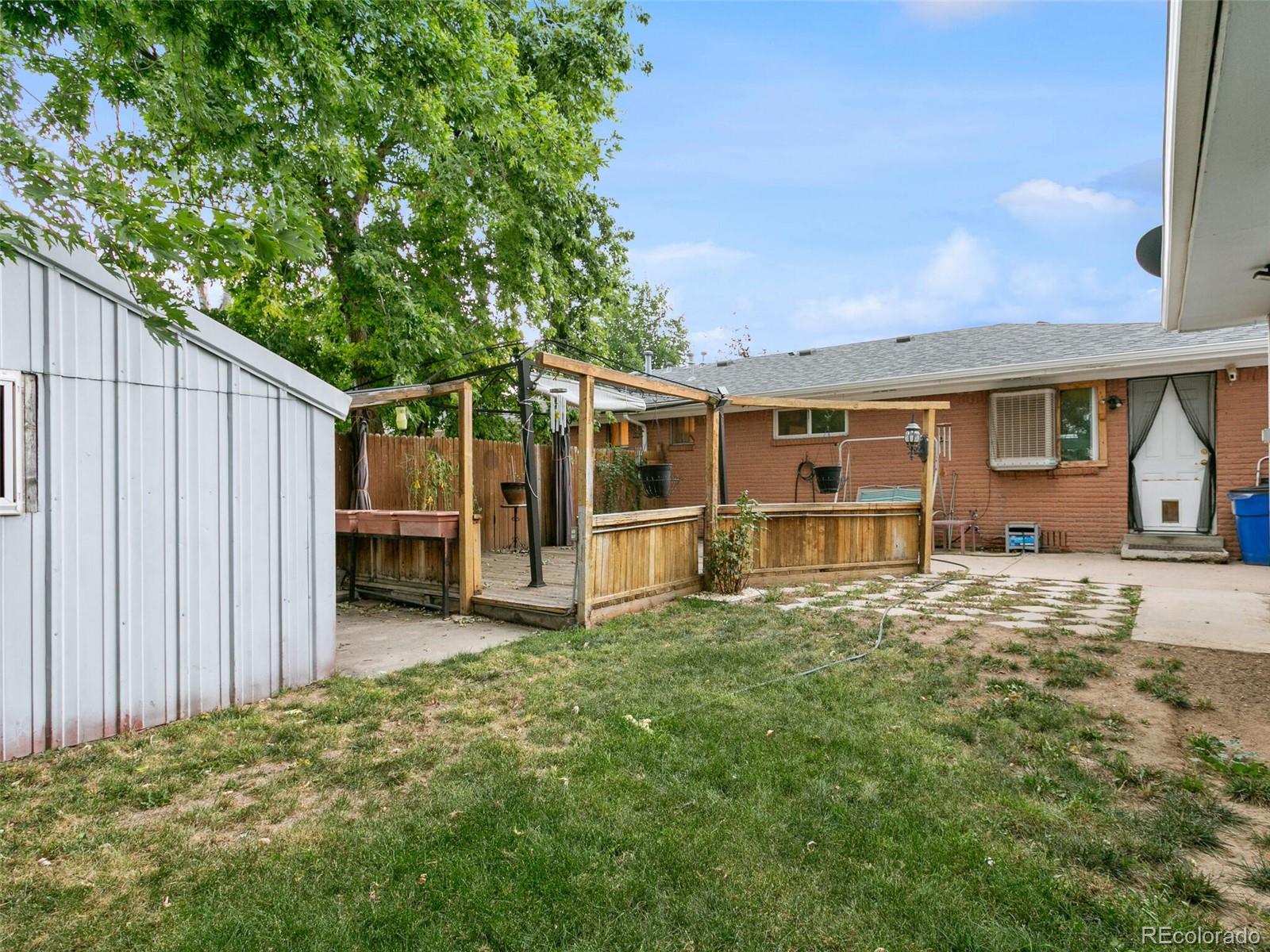 4615 Field Street Wheat Ridge, CO 80033 - Photo 37 of 39 a view of a house with backyard porch and sitting area