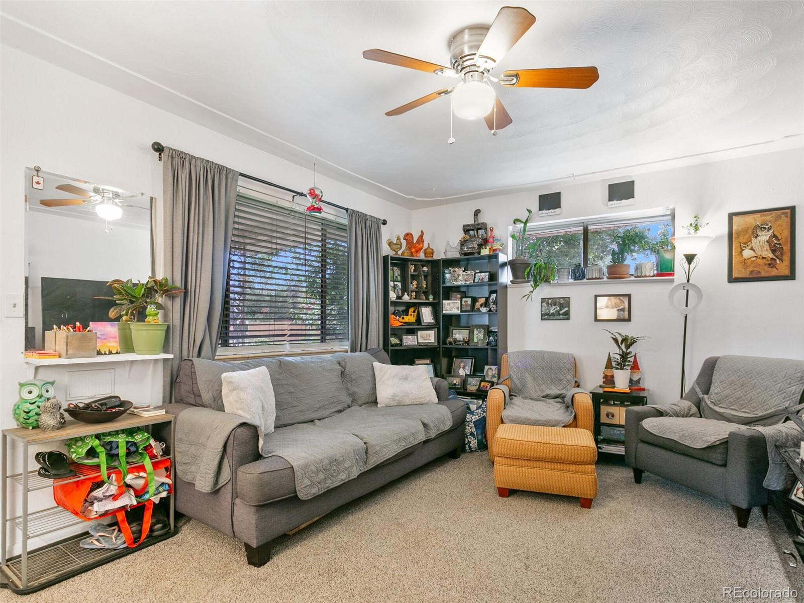 4615 Field Street Wheat Ridge, CO 80033 - Photo 7 of 39 a living room with furniture and a window