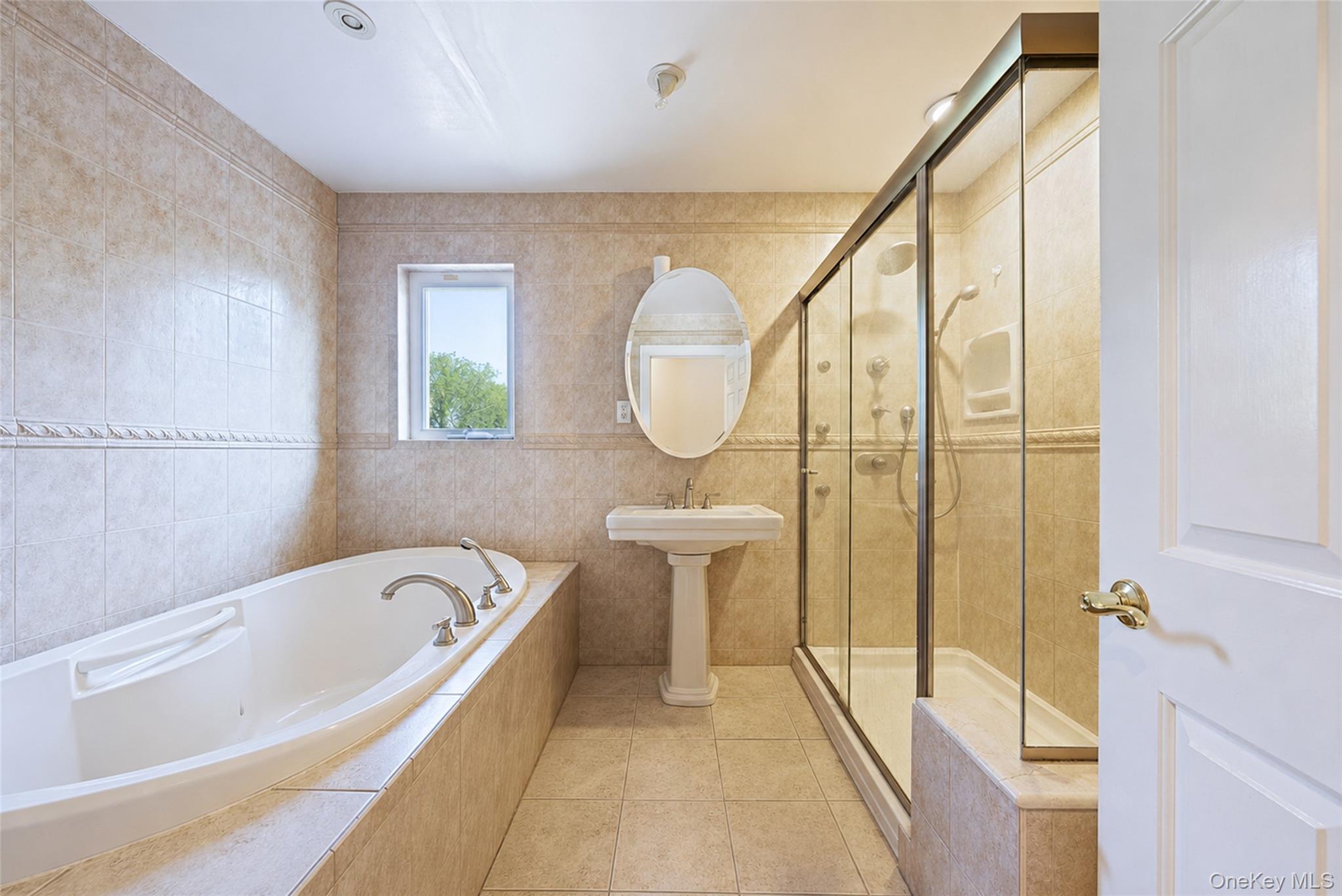 80 George Street Babylon, NY 11702 - Photo 31 of 41 a bathroom with a bathtub and a shower