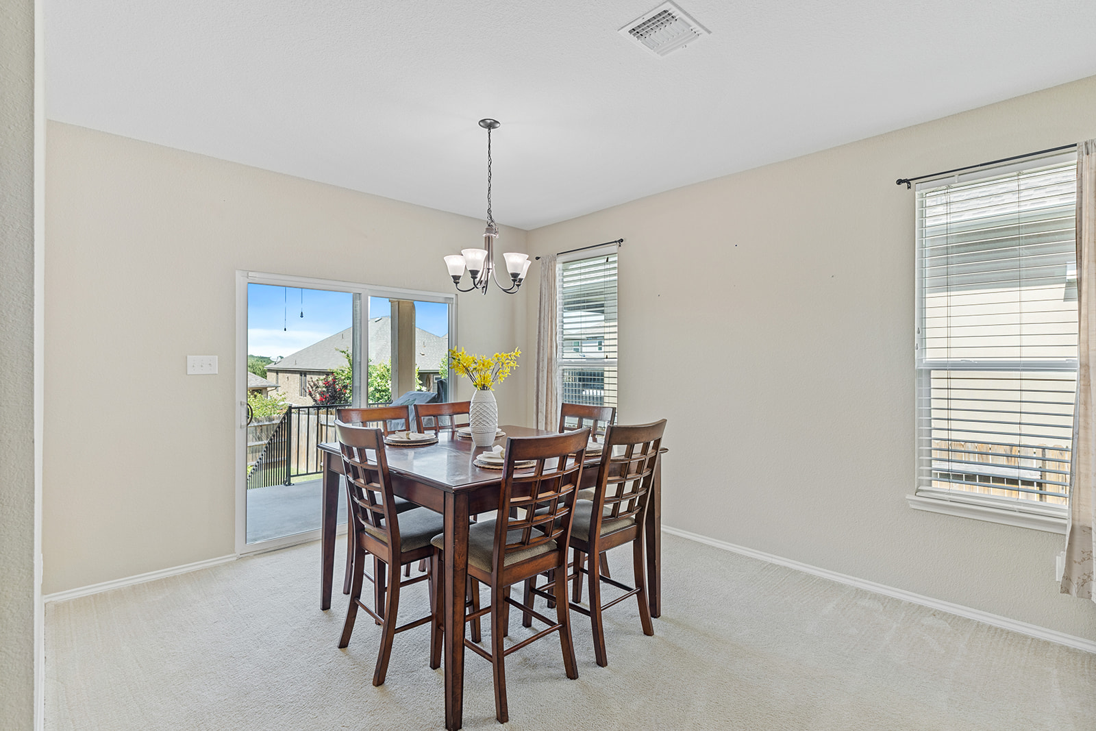 437 Sheepshank Drive Georgetown, TX 78633 - Photo 7 of 22 A well-lit dining area offers direct access to the outdoor living space.