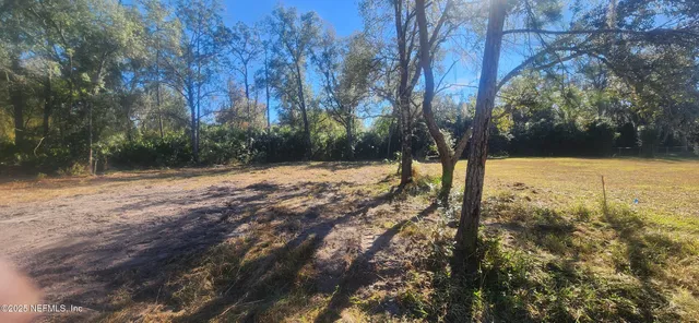 a view of yard covered with snow
