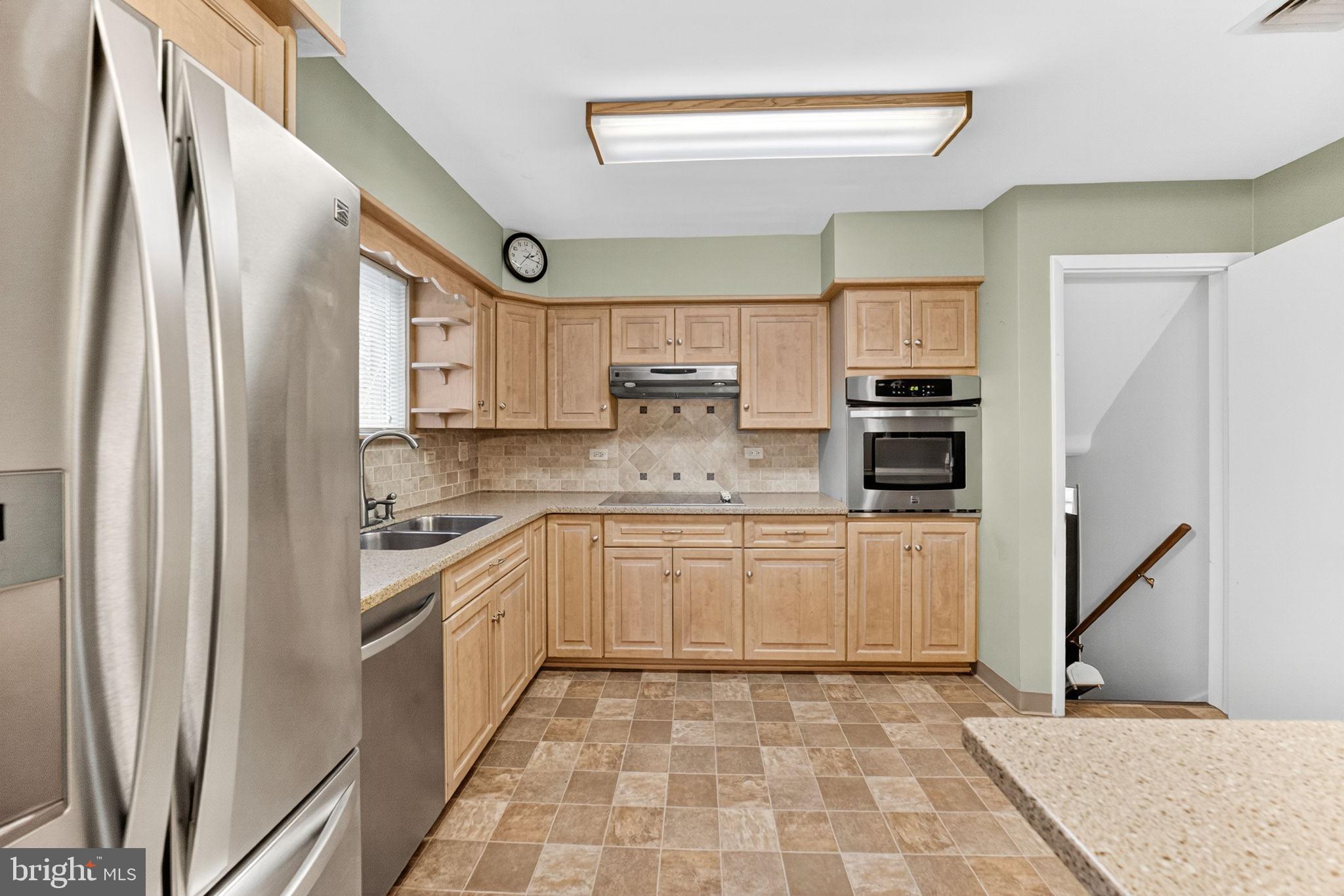 2304 Black River Road Bethlehem, PA 18015 - Photo 20 of 48 a kitchen with stainless steel appliances granite countertop a refrigerator sink and cabinets