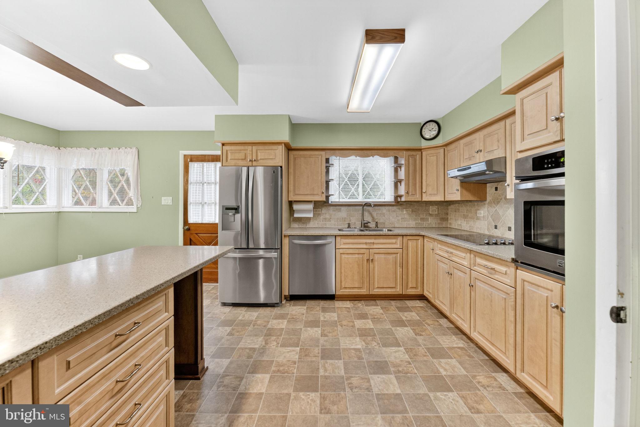 2304 Black River Road Bethlehem, PA 18015 - Photo 21 of 48 a kitchen with a refrigerator sink and cabinets