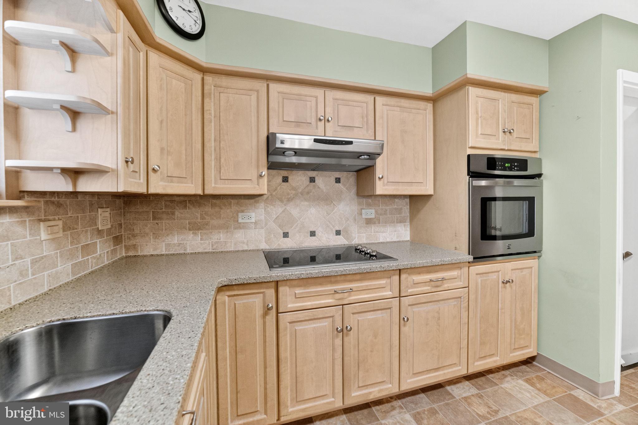 2304 Black River Road Bethlehem, PA 18015 - Photo 23 of 48 a kitchen with granite countertop a sink a stove and cabinets