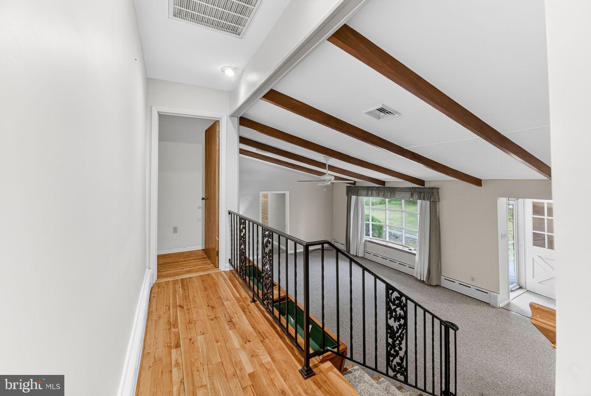 2304 Black River Road Bethlehem, PA 18015 - Photo 31 of 48 a view of a hallway with wooden floor and staircase
