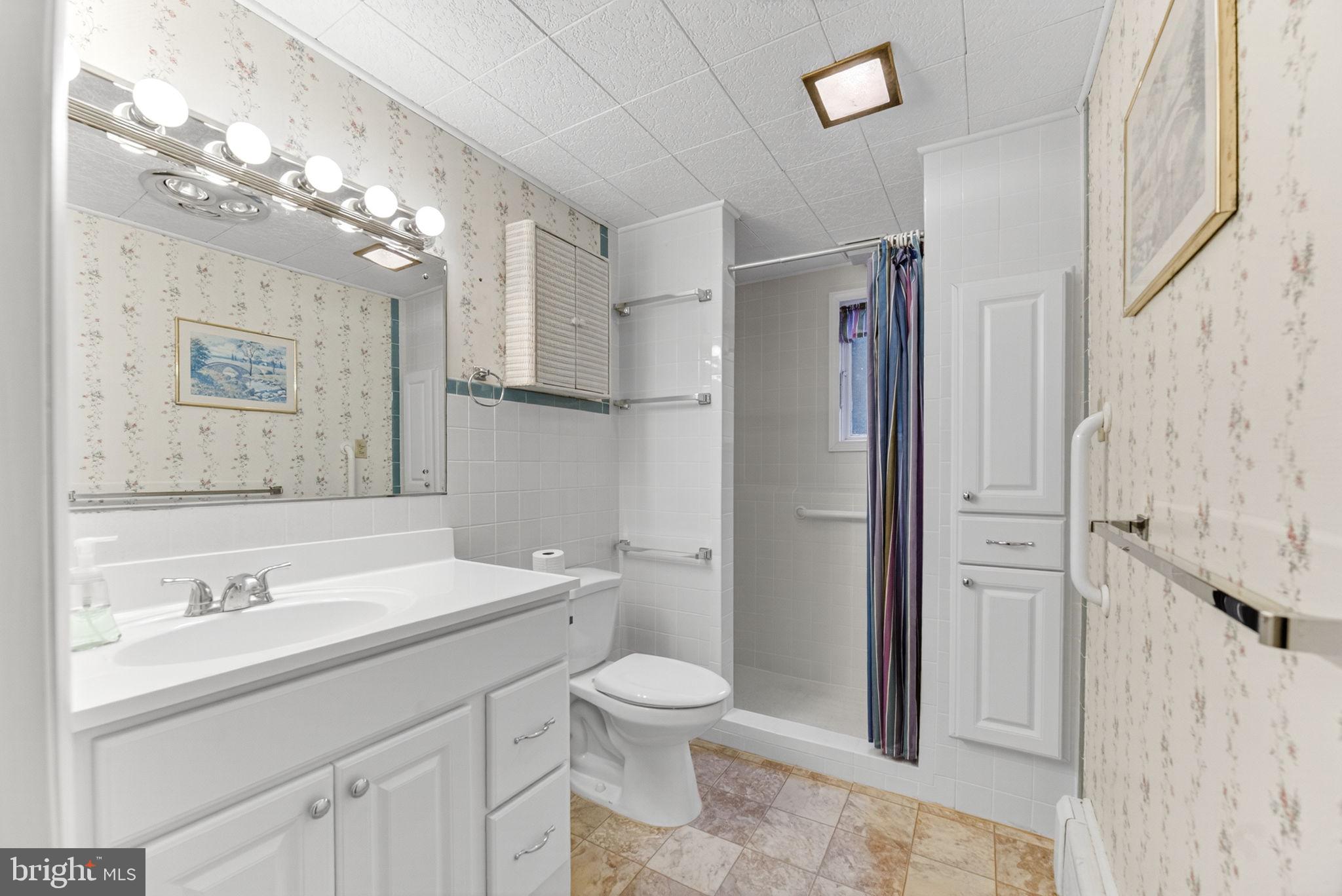 2304 Black River Road Bethlehem, PA 18015 - Photo 40 of 48 a bathroom with a sink a toilet a large mirror and shower