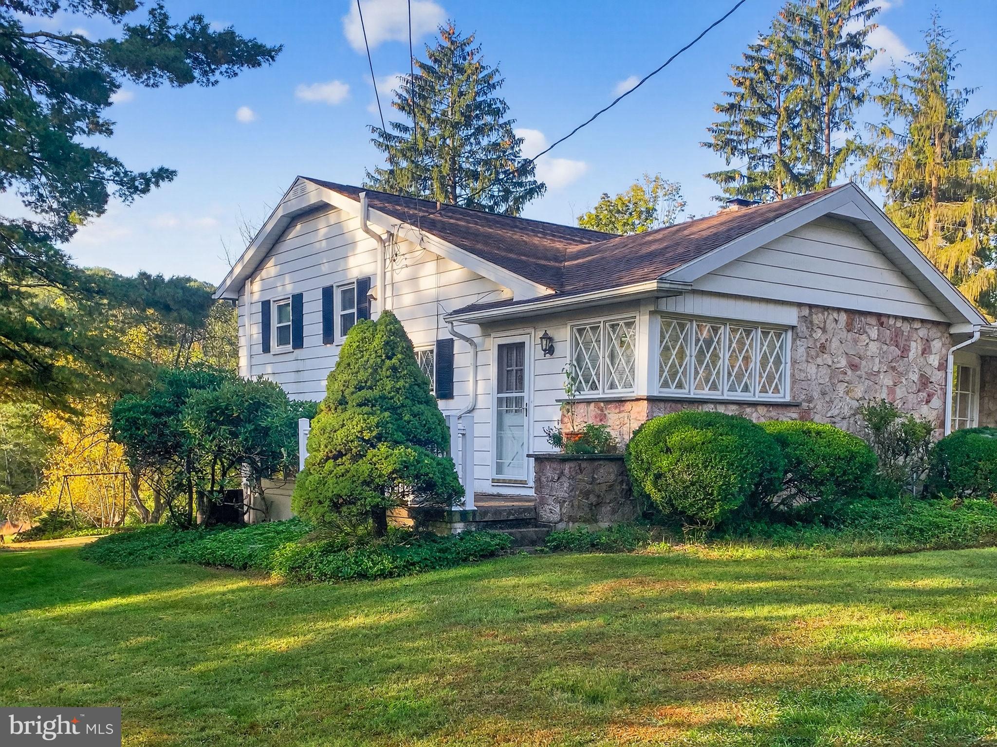 2304 Black River Road Bethlehem, PA 18015 - Photo 8 of 48 a front view of a house with a garden