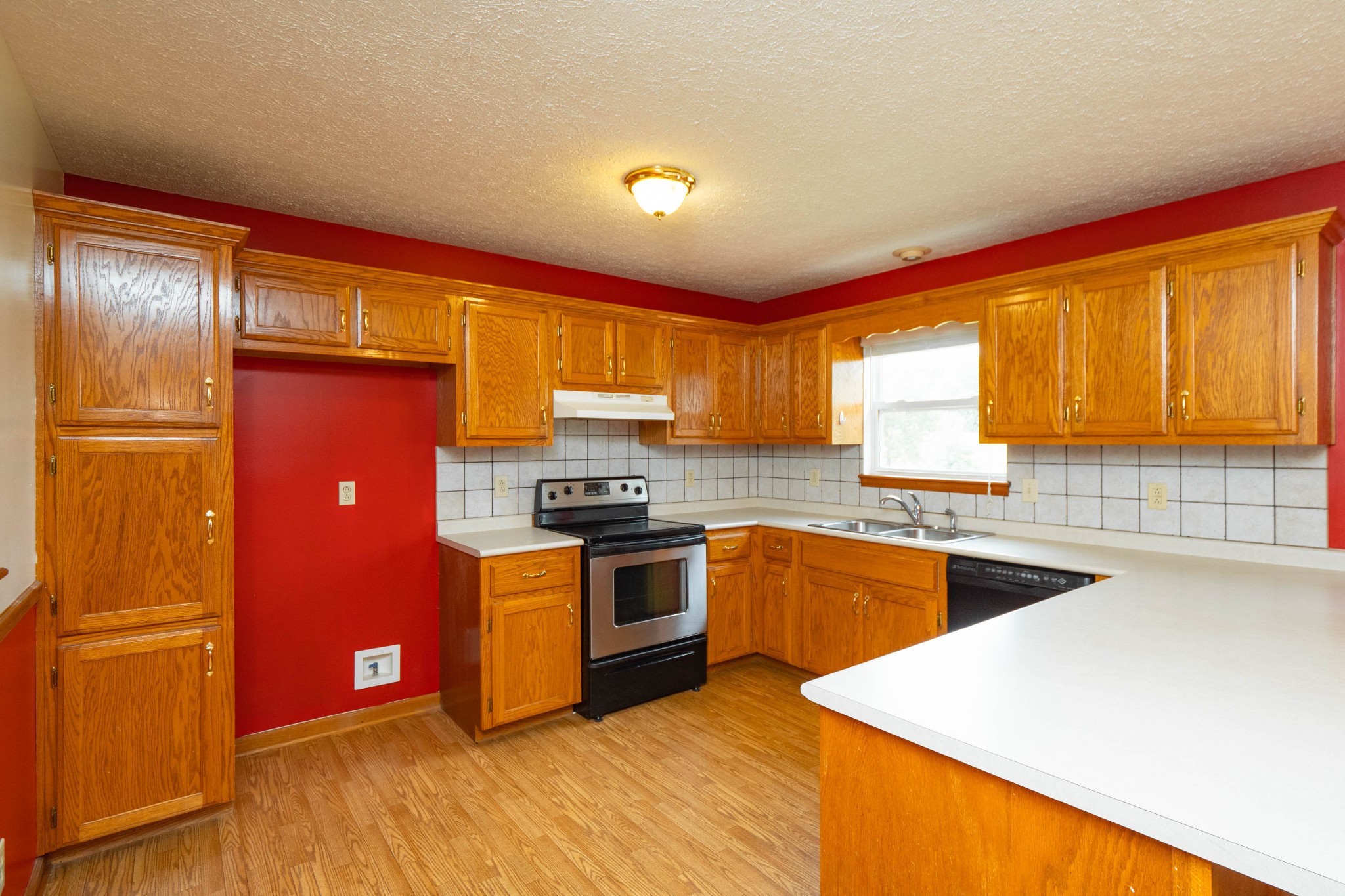6769 Lovel Cook Road Springfield, TN 37172 - Photo 7 of 24 a kitchen with stainless steel appliances granite countertop a refrigerator a sink dishwasher a stove with wooden cabinets and floor