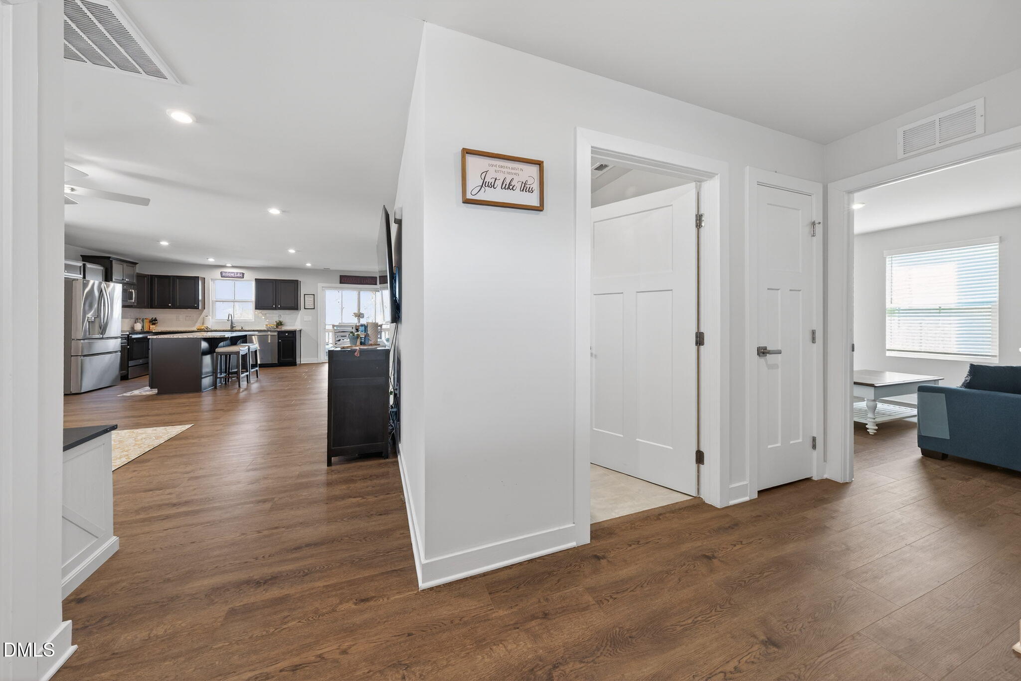 636 Jasmine Street Wendell, NC 27591 - Photo 4 of 30 a view of a living room kitchen with furniture and wooden floor