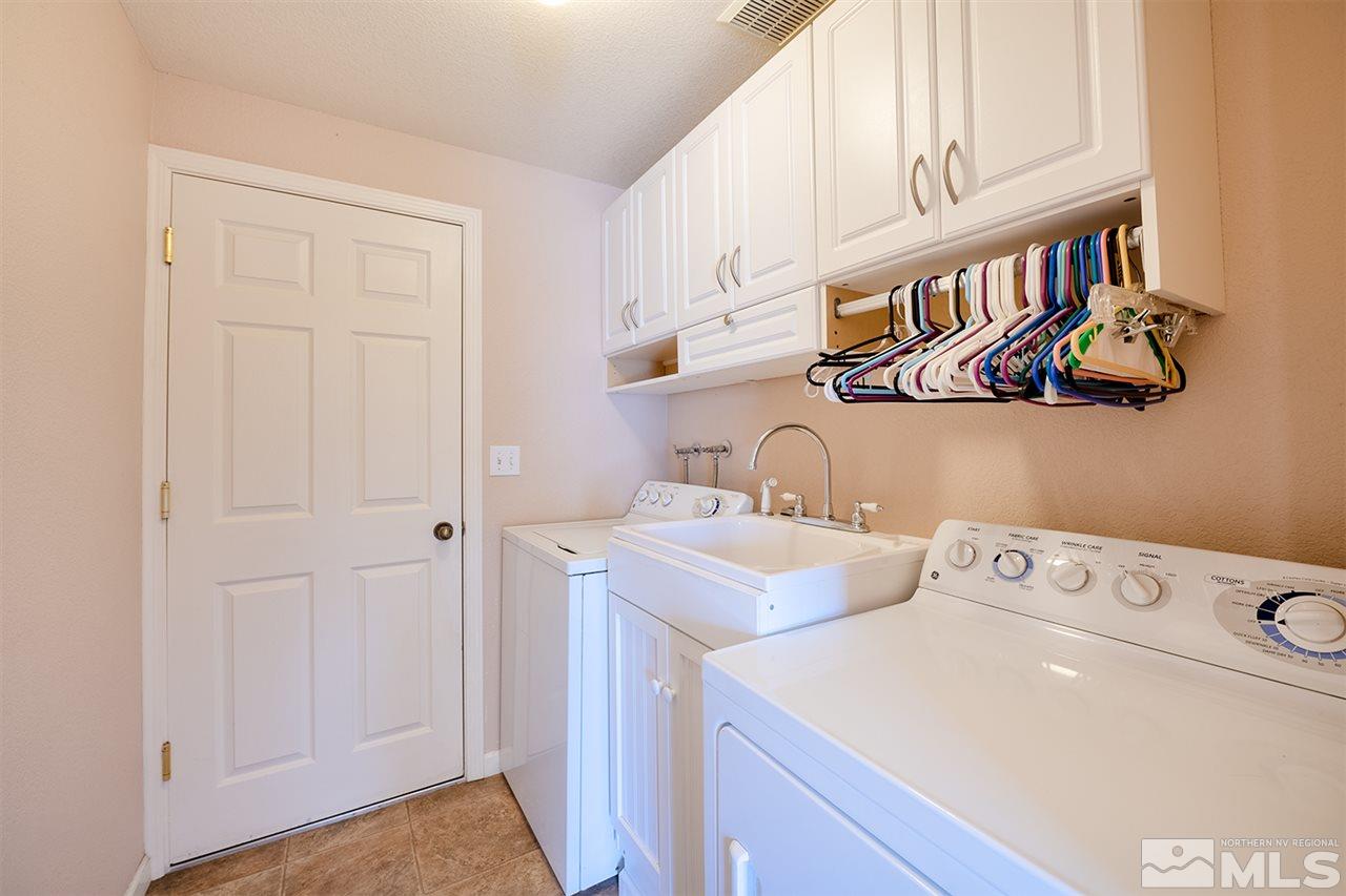 128 Empire Road Dayton, NV 89403 - Photo 17 of 20 a utility room with dryer and washer