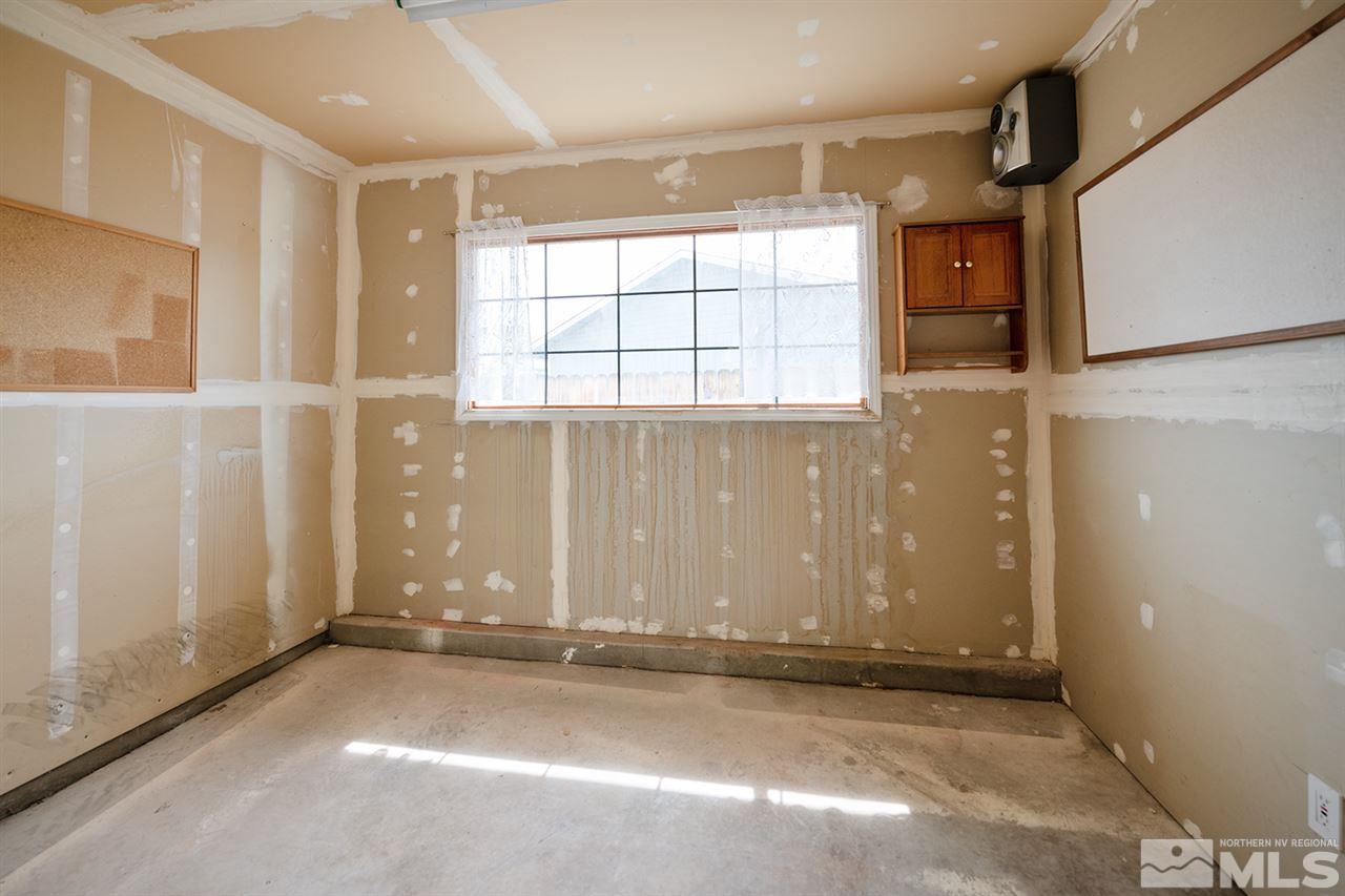 128 Empire Road Dayton, NV 89403 - Photo 19 of 20 an empty room with windows