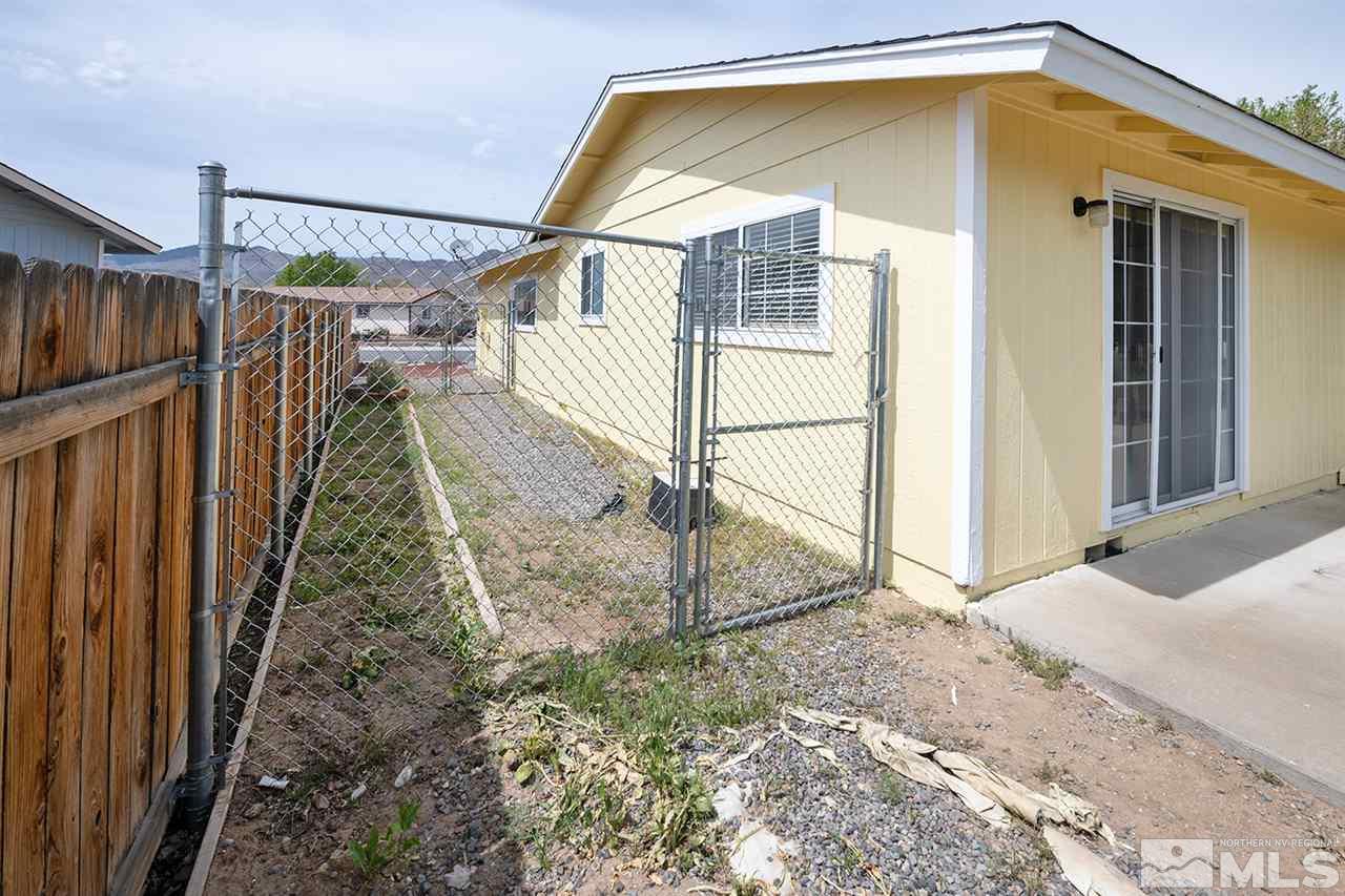 128 Empire Road Dayton, NV 89403 - Photo 5 of 20 a view of a house with a wooden deck