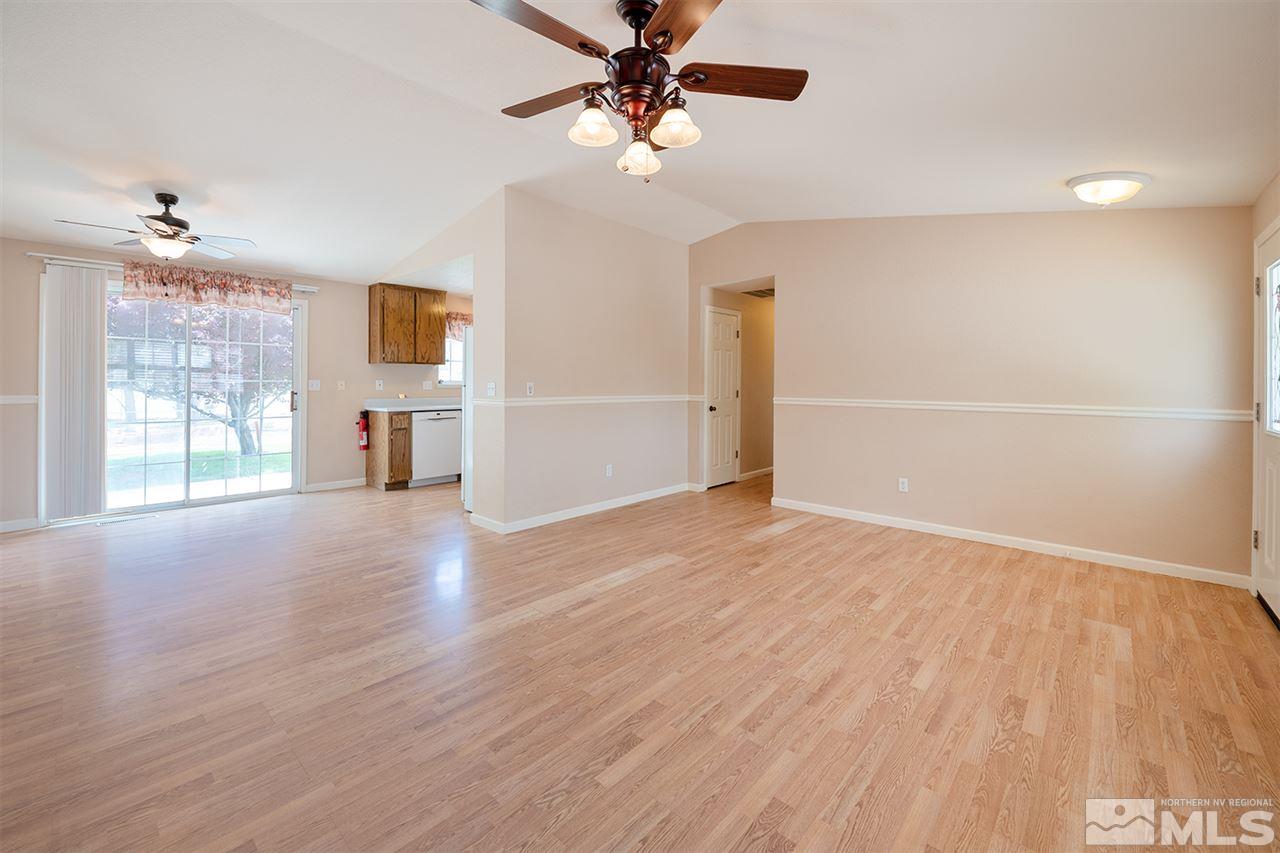 128 Empire Road Dayton, NV 89403 - Photo 8 of 20 wooden floor in an empty room with a window