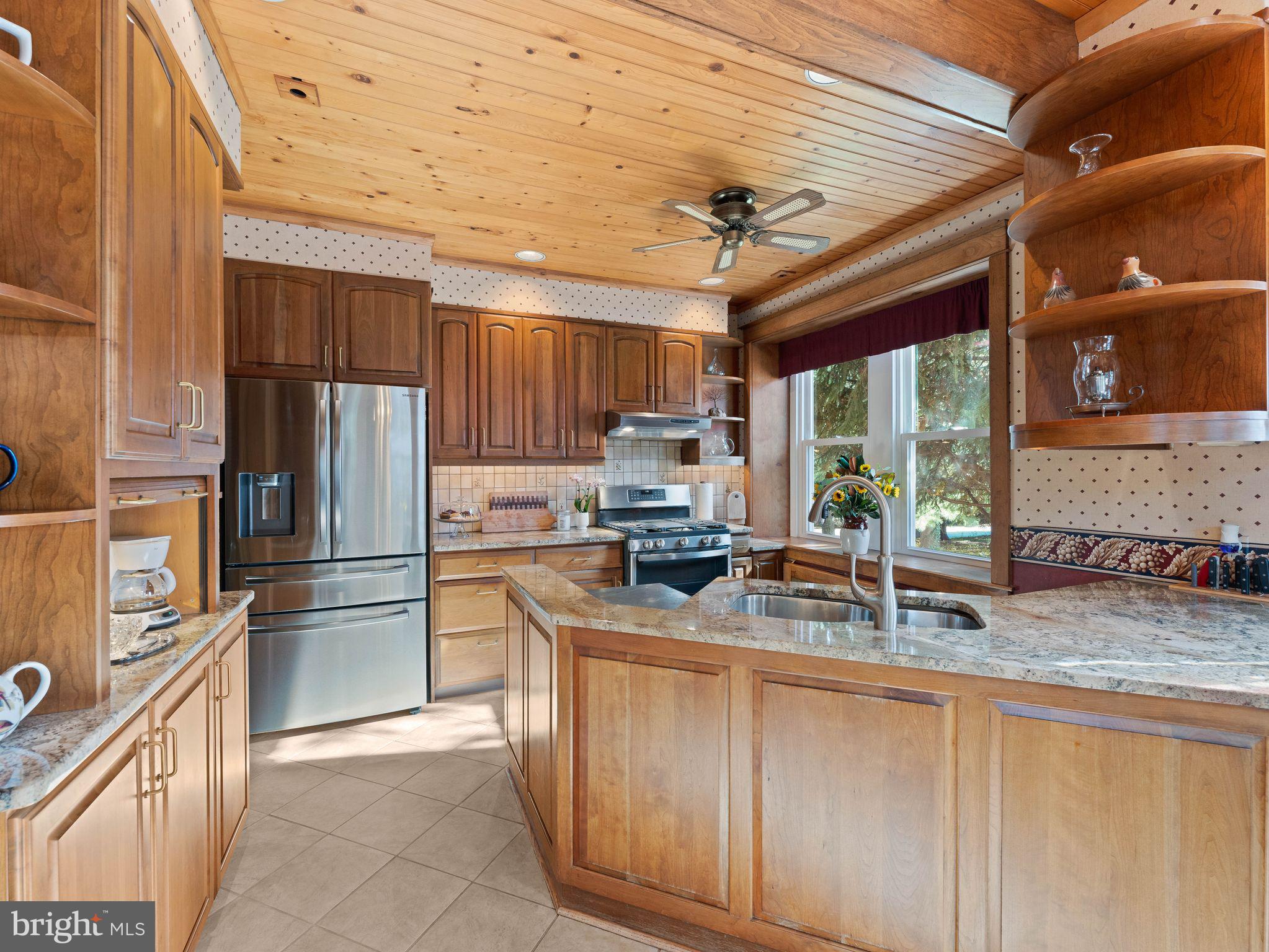 490 South Old Middletown Road Media, PA 19063 - Photo 24 of 79 a kitchen with stainless steel appliances granite countertop a refrigerator a stove a sink and a microwave