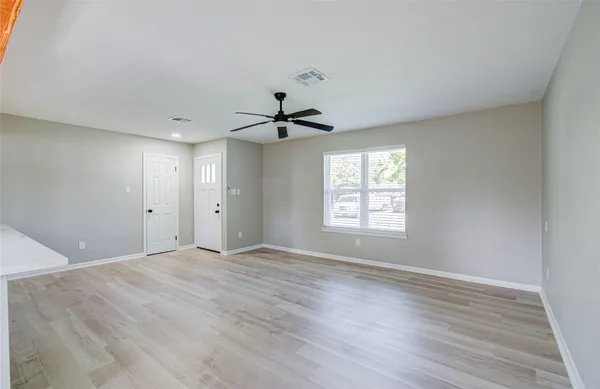 a view of an empty room with a window