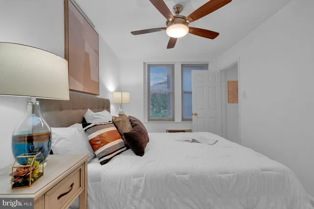 a bedroom with bed and window