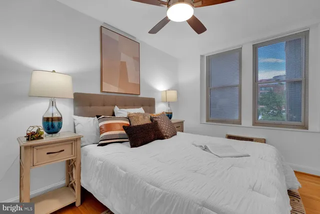 a bedroom with bed and window